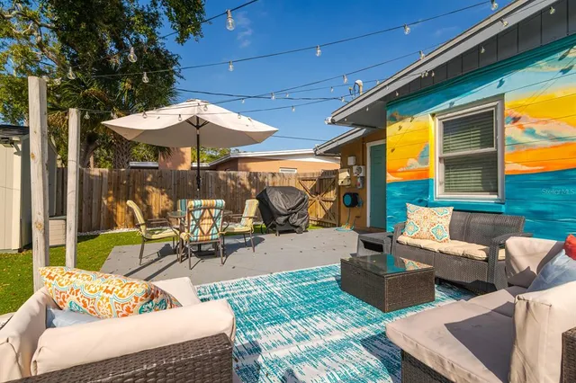 a view of a park with iron fence