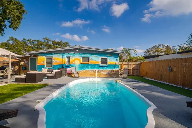 a view of a swimming pool with a patio