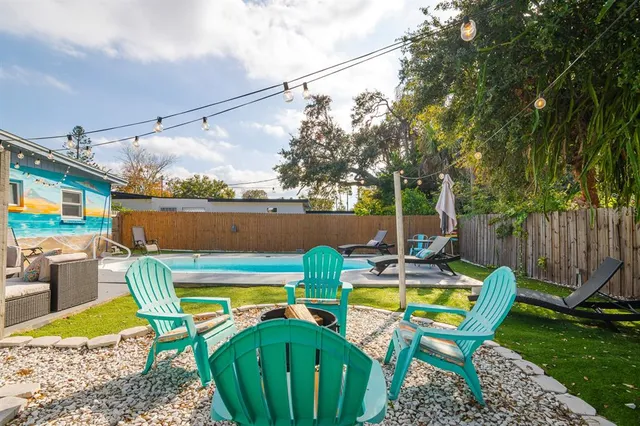 a view of a swimming pool with a lounge chairs