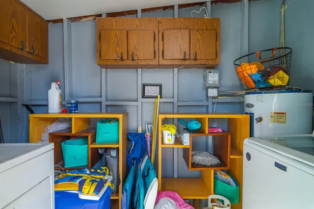 an aerial view of residential houses with outdoor space and swimming pool