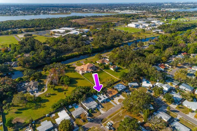 an aerial view of a house with swimming pool