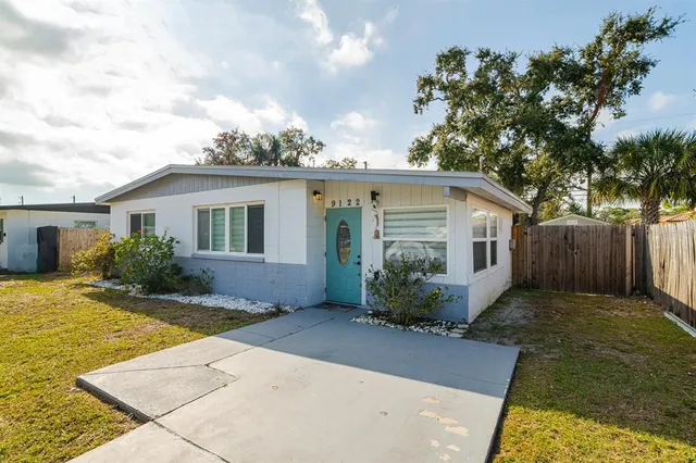 a view of a house with swimming pool