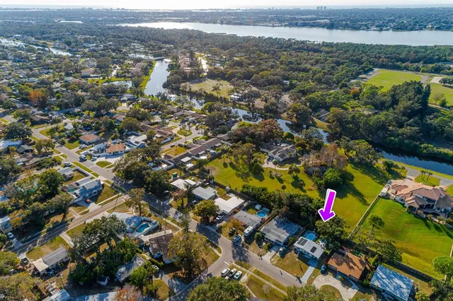 an aerial view of residential house with outdoor space and swimming pool