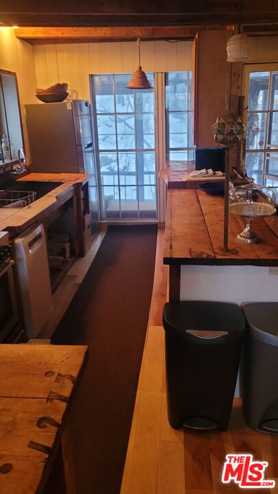 44 Brook Road Warren, VT 05674 - Photo 15 of 19 a bed sitting in a bedroom next to a window