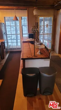 a bed sitting in a room next to a window