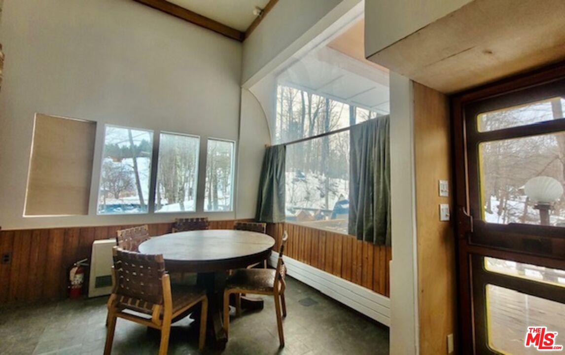 44 Brook Road Warren, VT 05674 - Photo 2 of 19 a view of a dining room with furniture and a window
