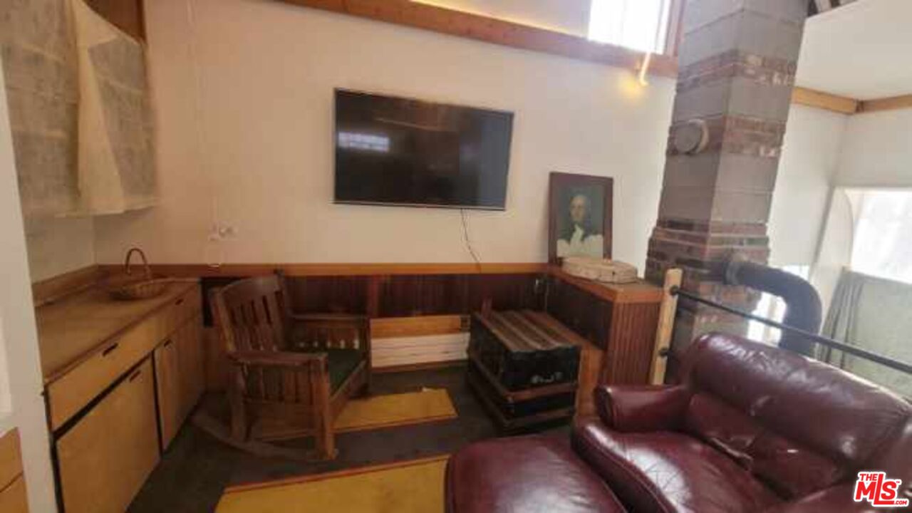 44 Brook Road Warren, VT 05674 - Photo 3 of 19 a living room with furniture and a flat screen tv