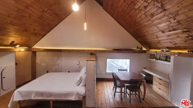 a bed room with a bed and a window