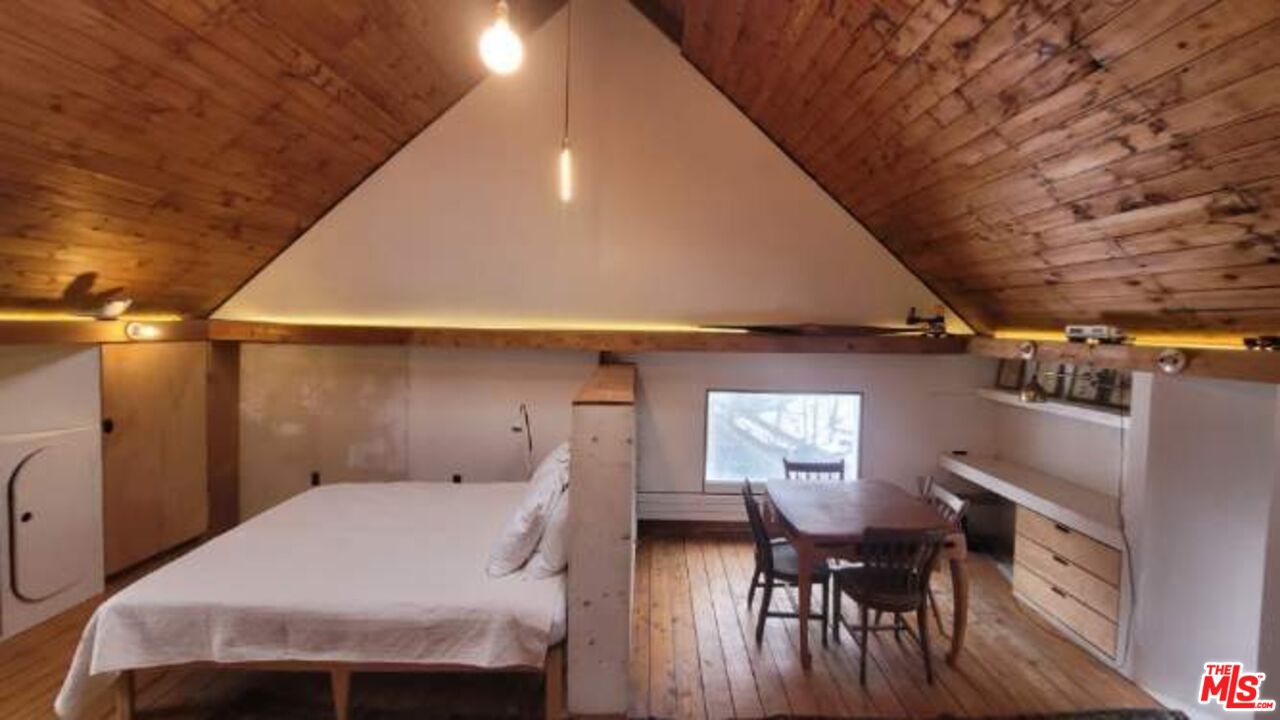 44 Brook Road Warren, VT 05674 - Photo 10 of 19 a bed room with a bed and a window