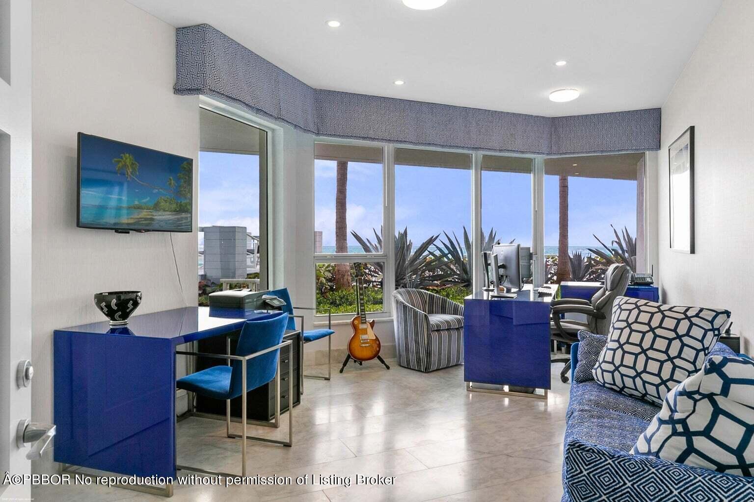 619 South Beach Road Hobe Sound, FL 33455 - Photo 14 of 23 a living room with furniture a large window and a flat screen tv