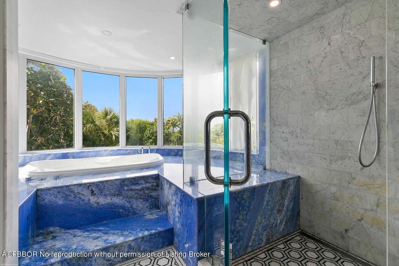 619 South Beach Road Hobe Sound, FL 33455 - Photo 17 of 23 a view of a bath tub sitting in a bathroom