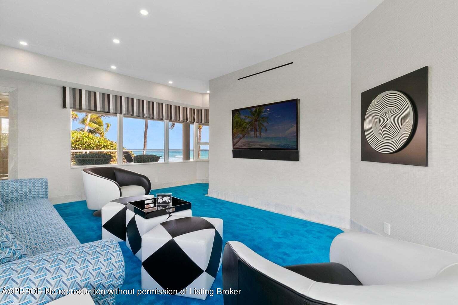 619 South Beach Road Hobe Sound, FL 33455 - Photo 18 of 23 a living room with furniture and a flat screen tv