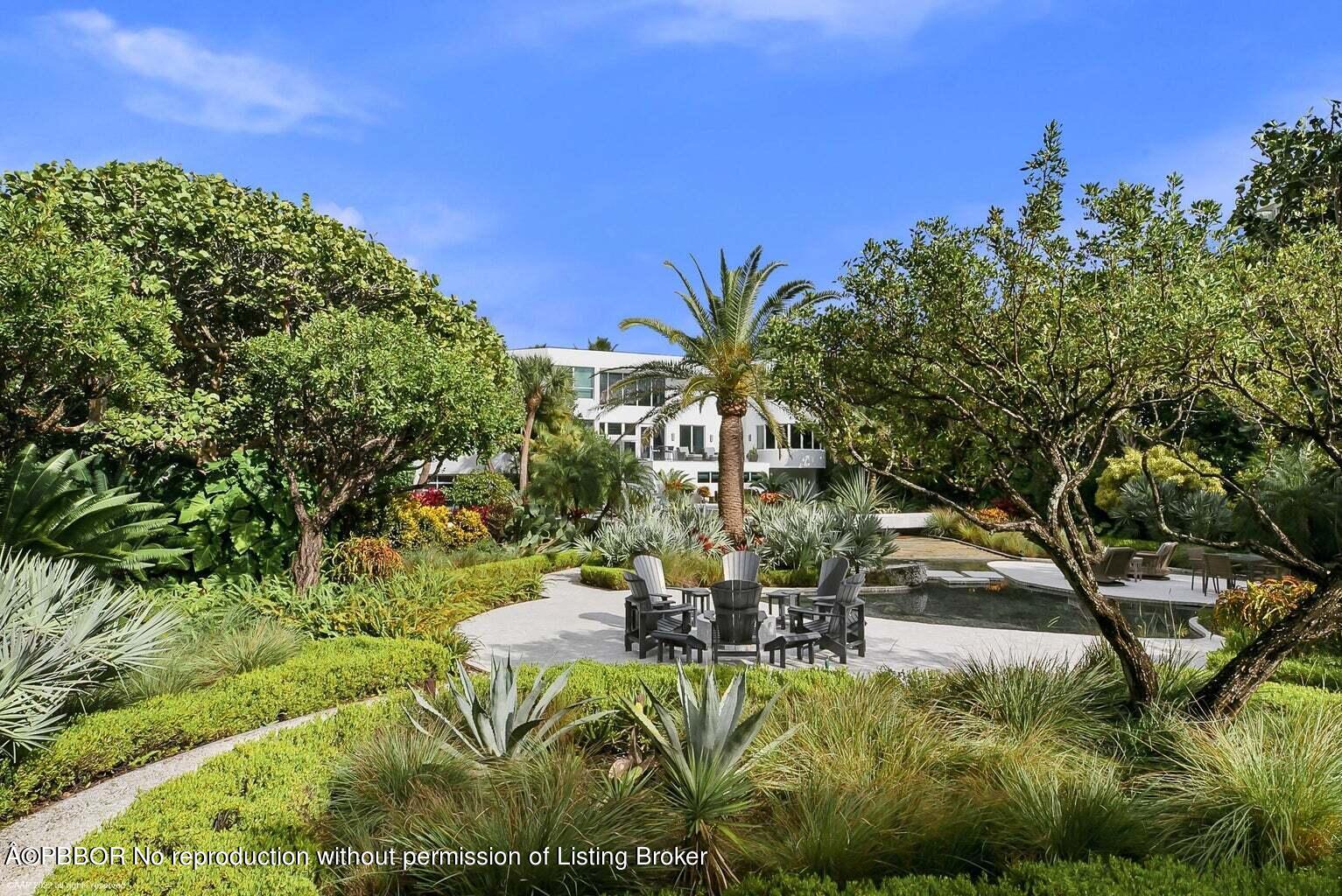 619 South Beach Road Hobe Sound, FL 33455 - Photo 22 of 23 a view of a swimming pool with a yard