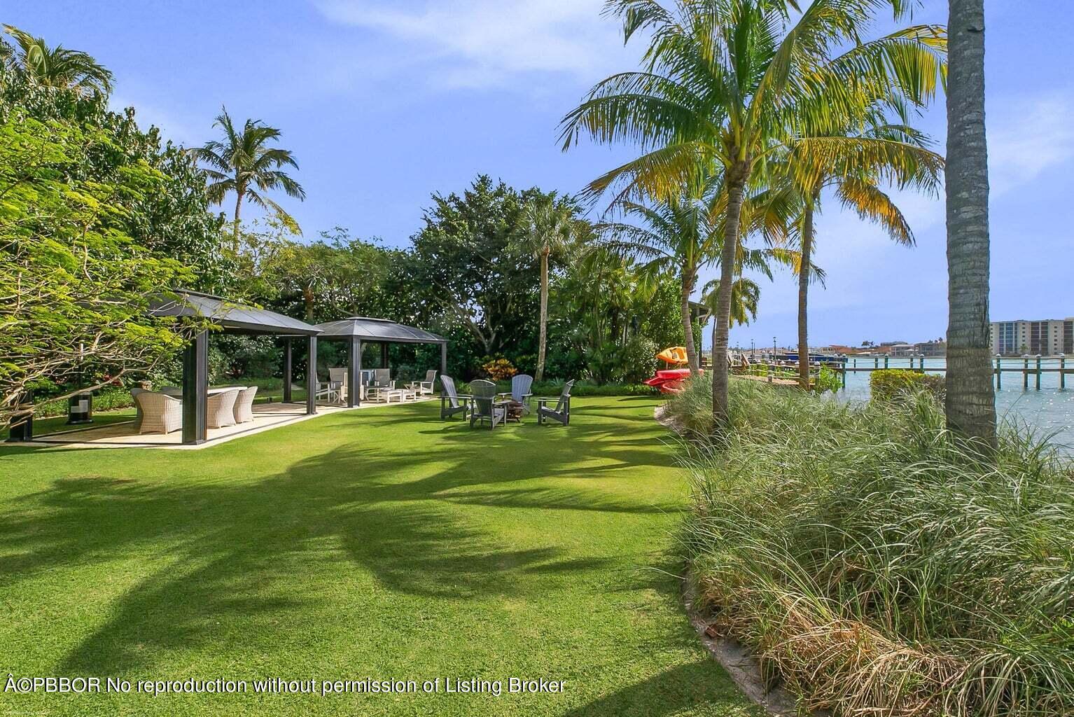 619 South Beach Road Hobe Sound, FL 33455 - Photo 5 of 23 a view of a house with a big yard
