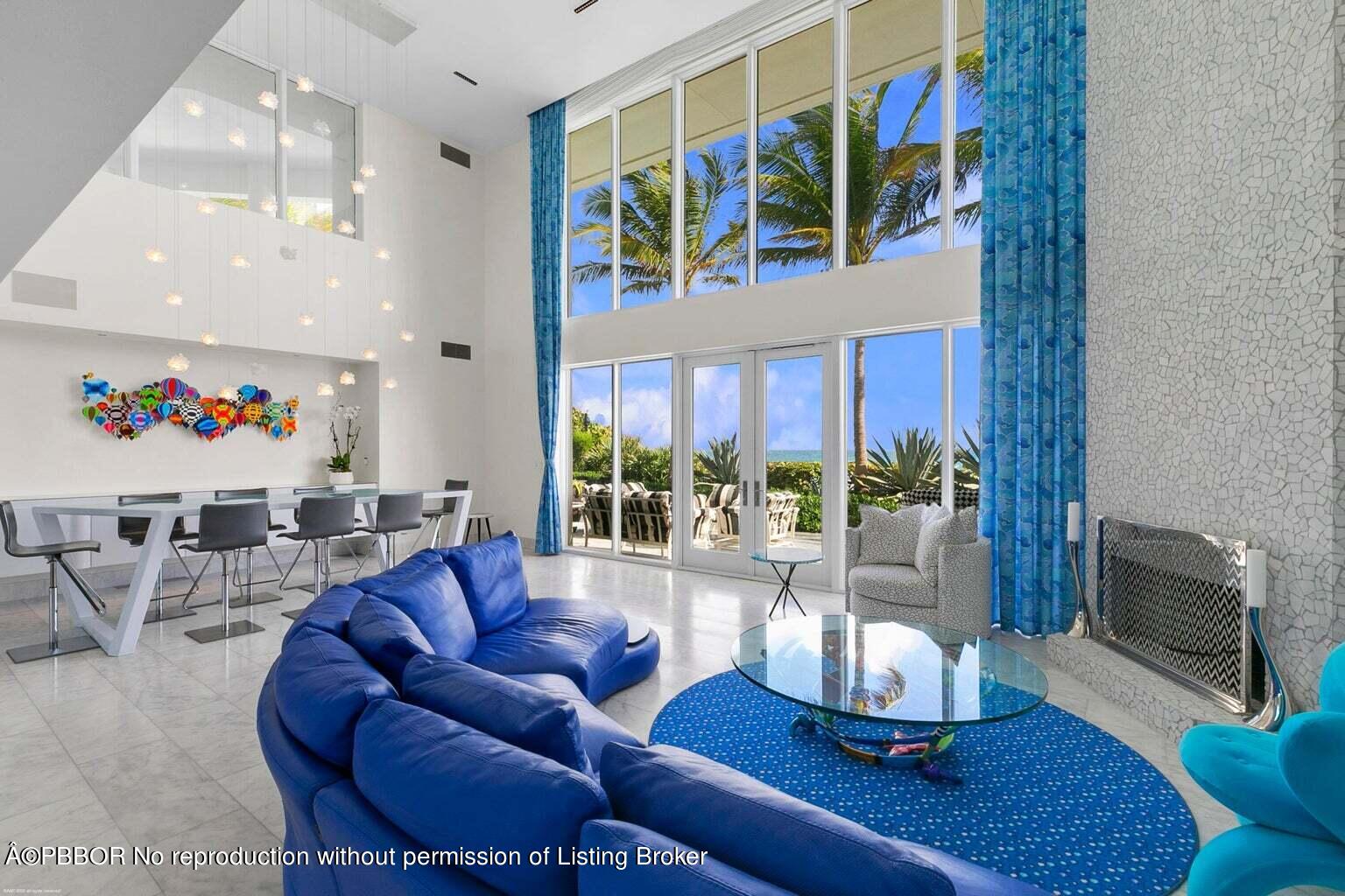 619 South Beach Road Hobe Sound, FL 33455 - Photo 8 of 23 a living room with furniture fireplace and a large window