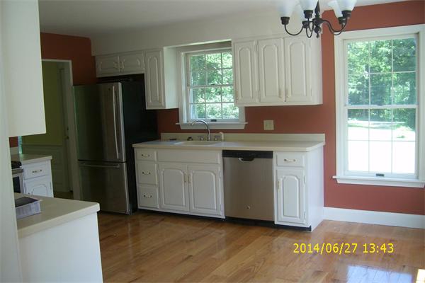 55 Ridge Road Rutland, MA 01543 - Photo 19 of 24 a kitchen with a refrigerator and window