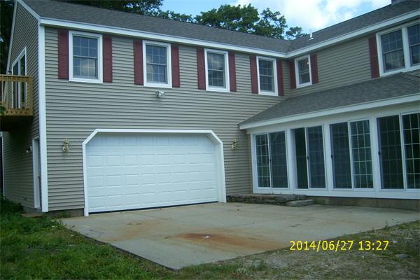 55 Ridge Road Rutland, MA 01543 - Photo 3 of 24 a front view of a house with a garden