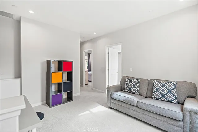 a bedroom with a bed and a tv