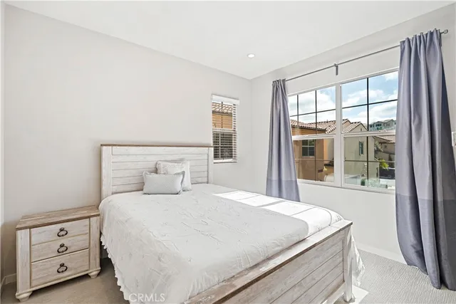 a bedroom with a bed and a couch