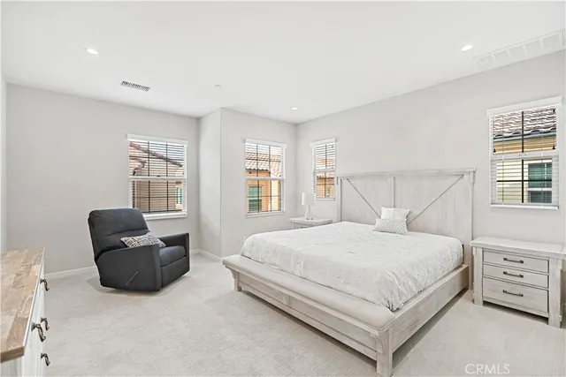 a bedroom with a bed and a closet