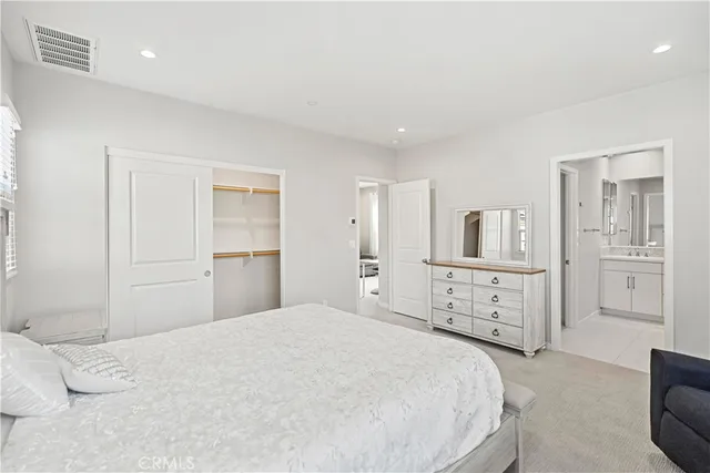 a bedroom with a large bed and a large window