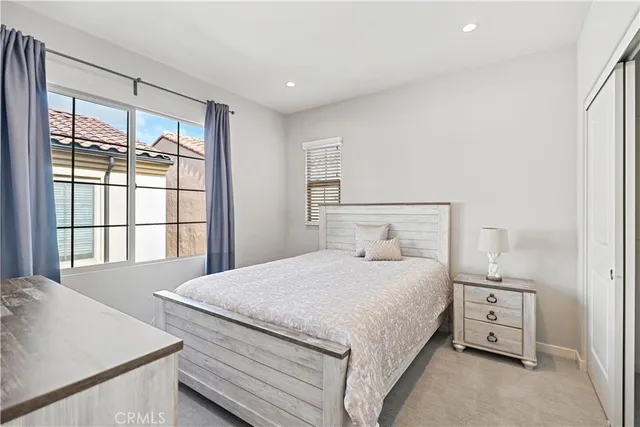 a bathroom with a granite countertop sink a toilet and a shower
