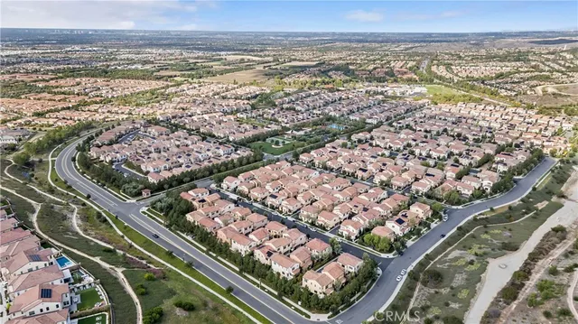 front view of a brick building next to a yard