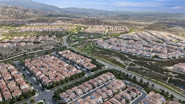an aerial view of a residential houses with outdoor space
