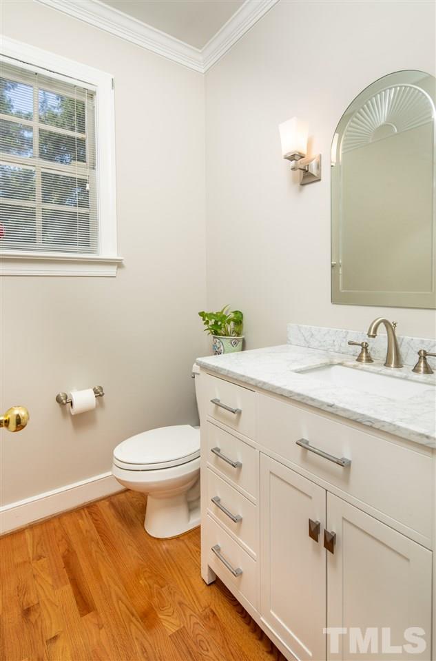 2709 Amstel Way Raleigh, NC 27613 - Photo 14 of 30 a bathroom with a granite countertop toilet sink and mirror