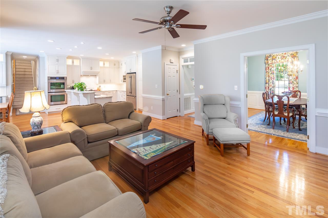 2709 Amstel Way Raleigh, NC 27613 - Photo 7 of 30 a living room with furniture kitchen view and a wooden floor