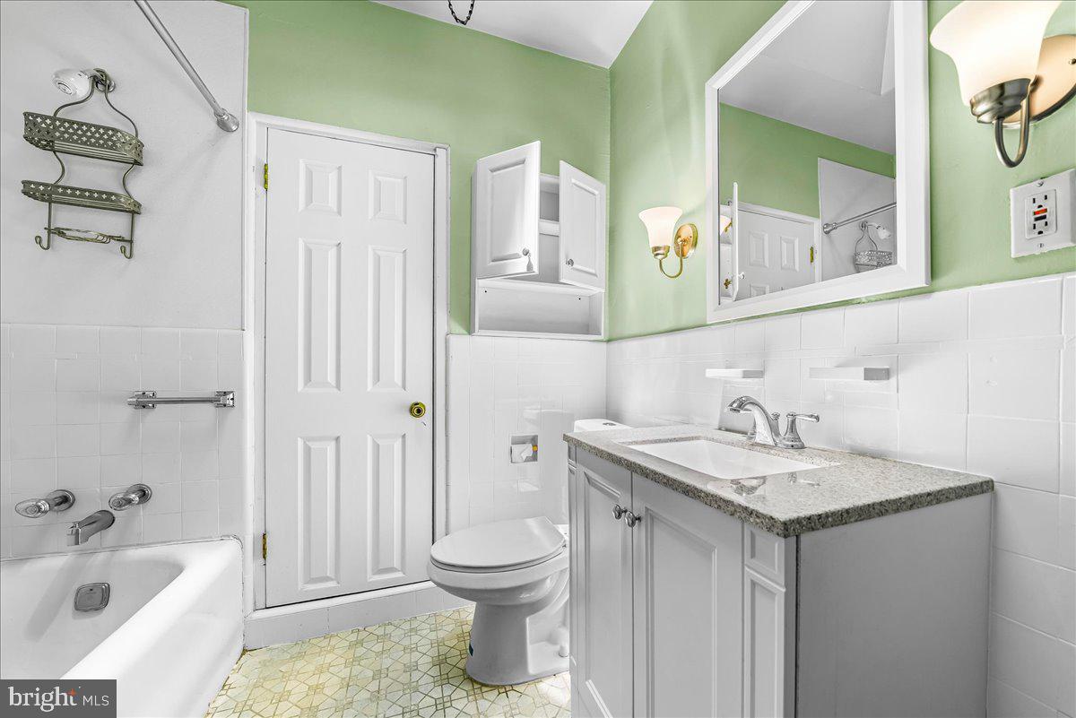 217 Avon Road Upper Darby, PA 19082 - Photo 13 of 16 a bathroom with a sink and a toilet