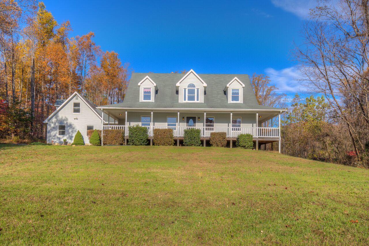 224 Shade Hollow Road Blue Ridge, VA 24064 - Photo 1 of 38 a front view of a house with a big yard