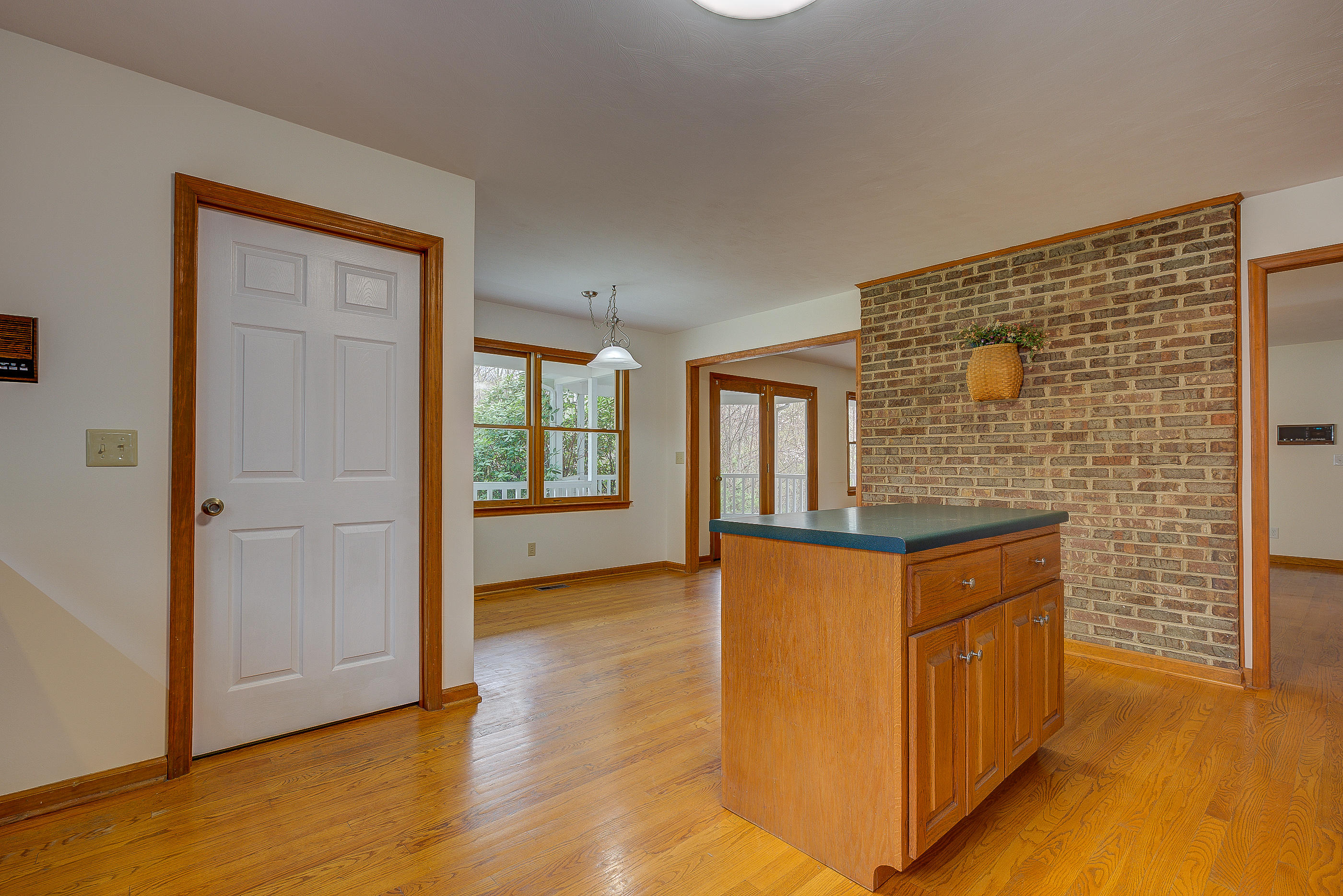 224 Shade Hollow Road Blue Ridge, VA 24064 - Photo 14 of 38 a view of an empty room with window and wooden floor