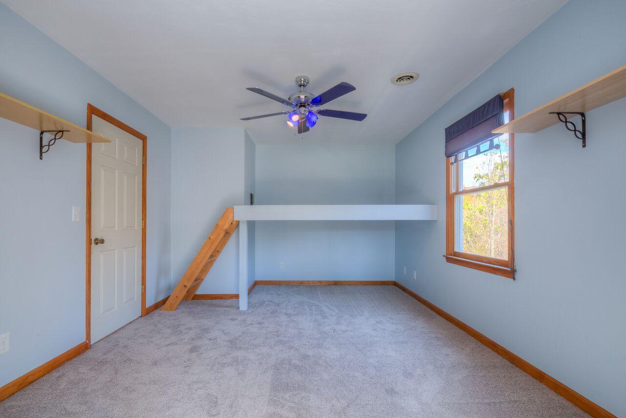 224 Shade Hollow Road Blue Ridge, VA 24064 - Photo 19 of 38 a view of an empty room with a window