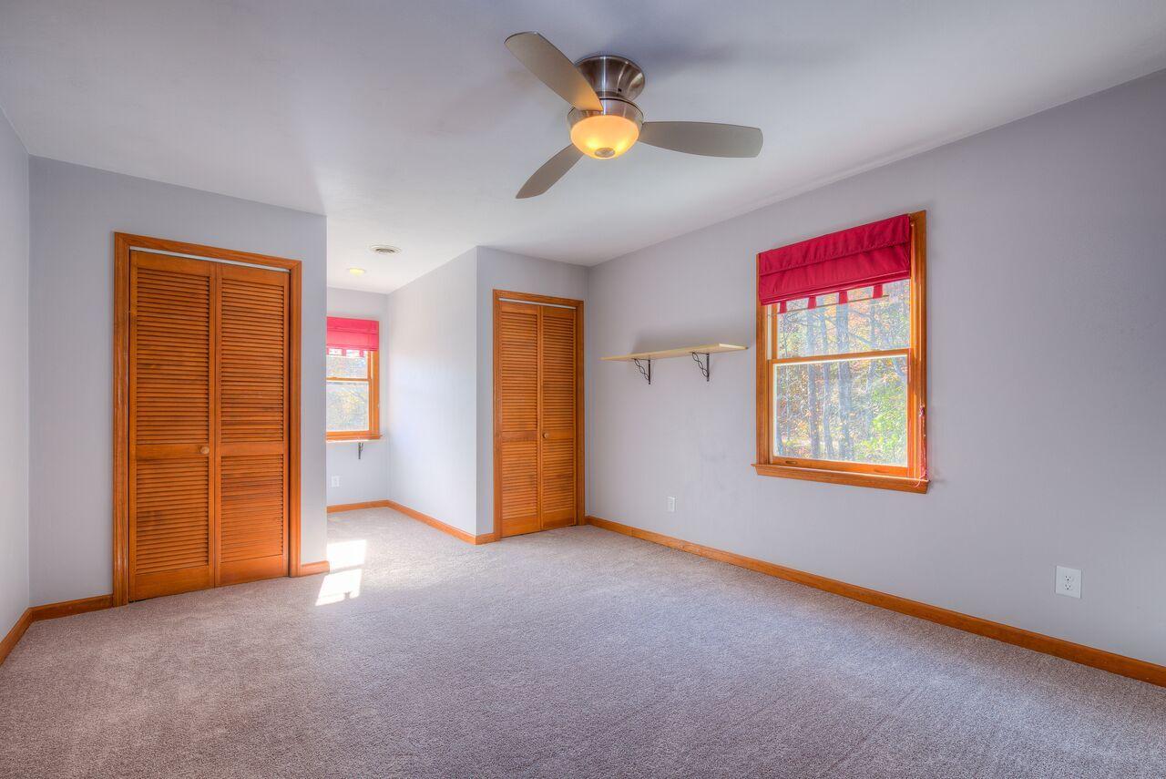224 Shade Hollow Road Blue Ridge, VA 24064 - Photo 22 of 38 an empty room with windows and closet
