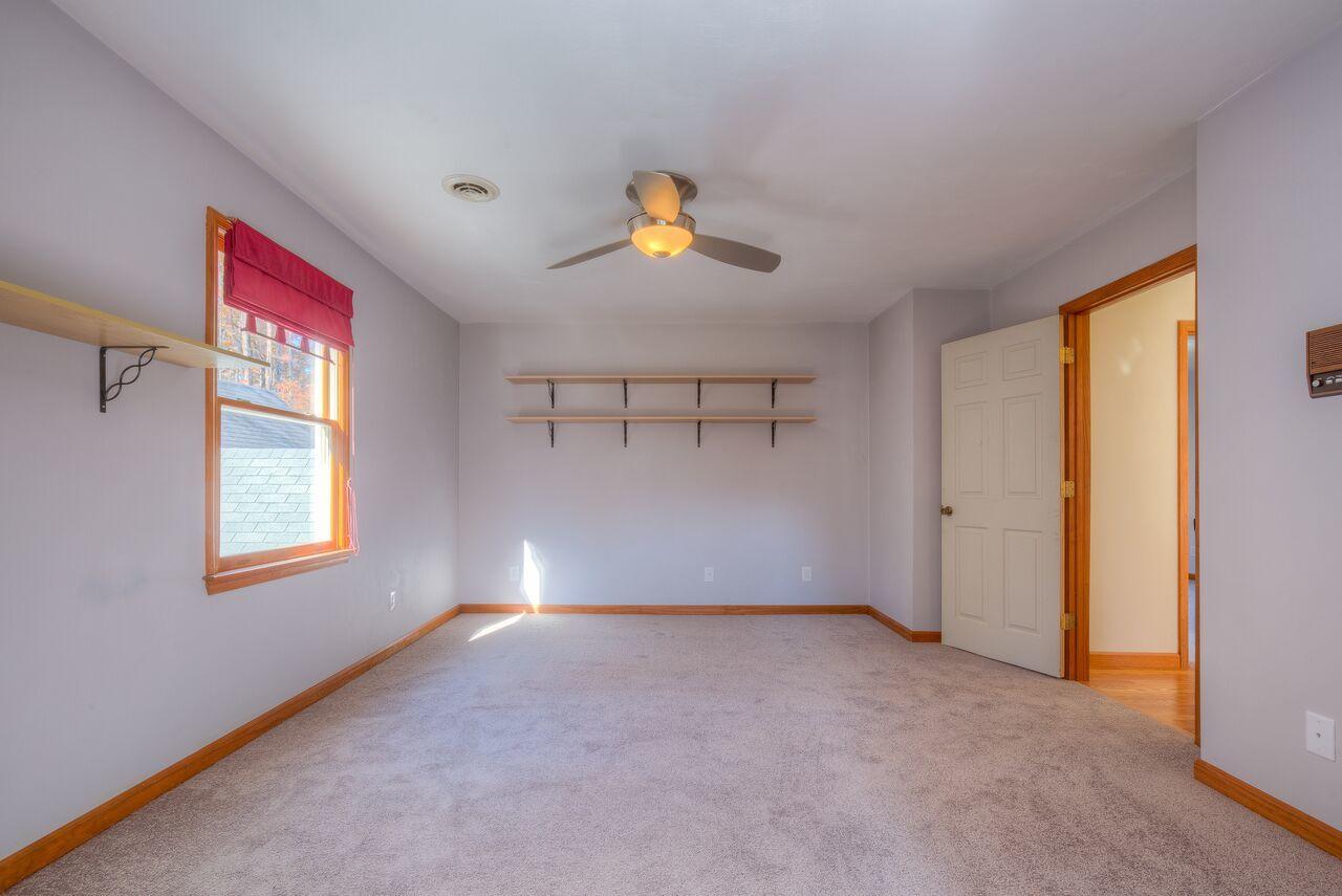 224 Shade Hollow Road Blue Ridge, VA 24064 - Photo 23 of 38 a view of an empty room with window and a kitchen