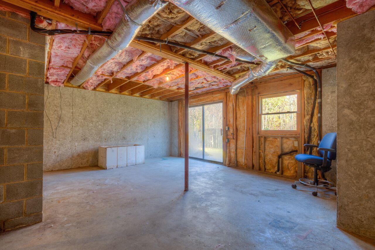224 Shade Hollow Road Blue Ridge, VA 24064 - Photo 25 of 38 a view of a room with glass door and furniture