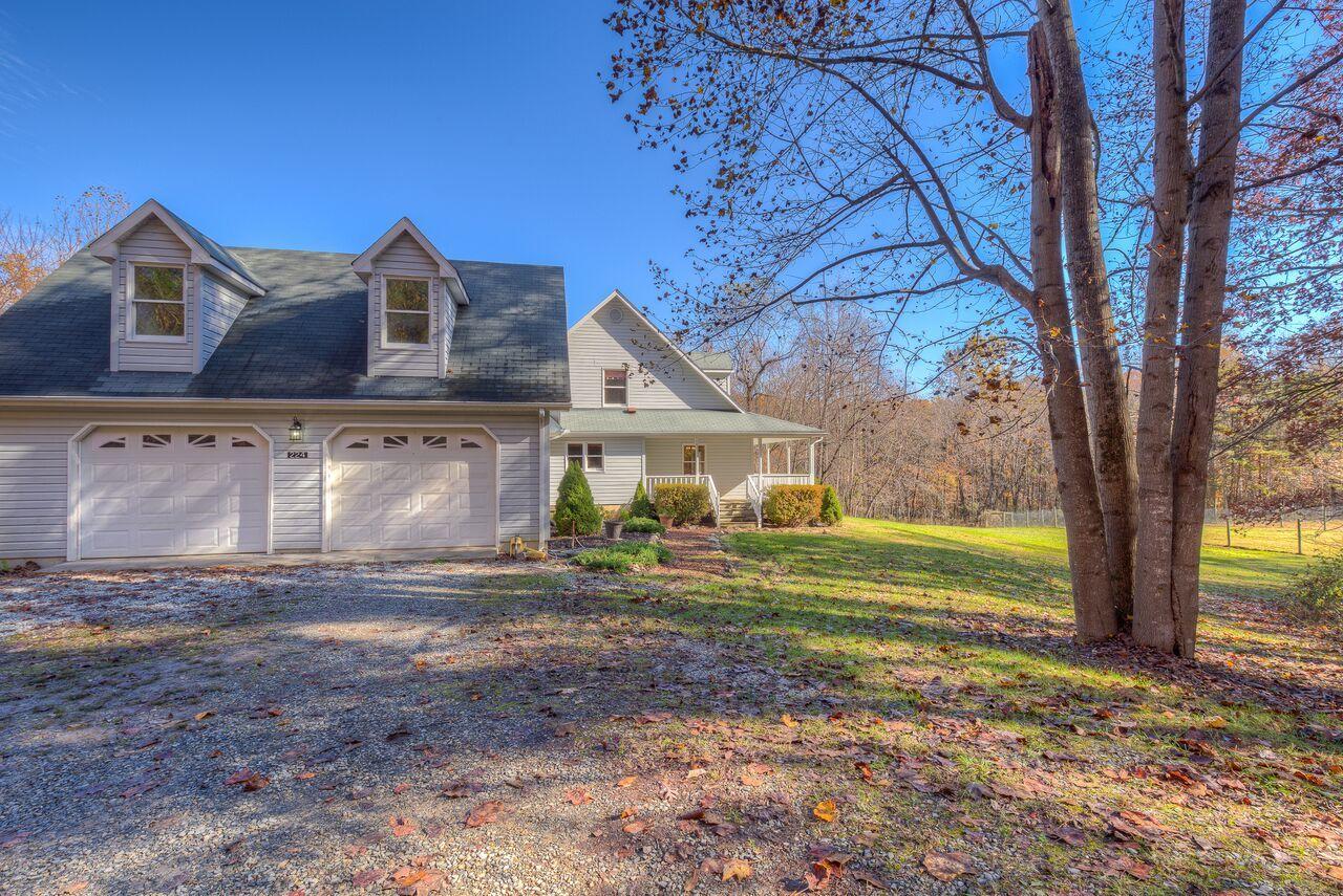 224 Shade Hollow Road Blue Ridge, VA 24064 - Photo 28 of 38 a front view of a house with garden