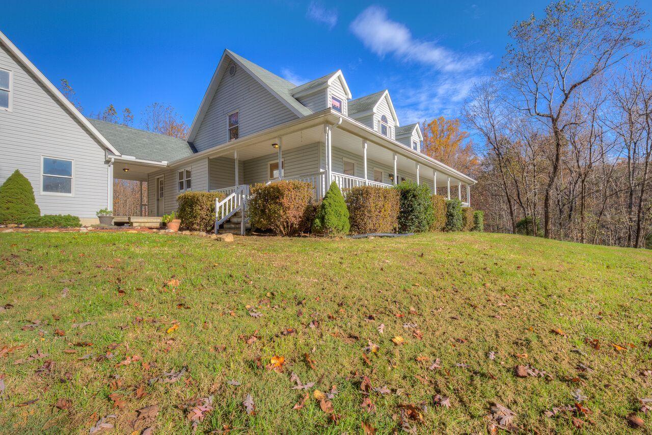 224 Shade Hollow Road Blue Ridge, VA 24064 - Photo 4 of 38 a front view of a house with a yard