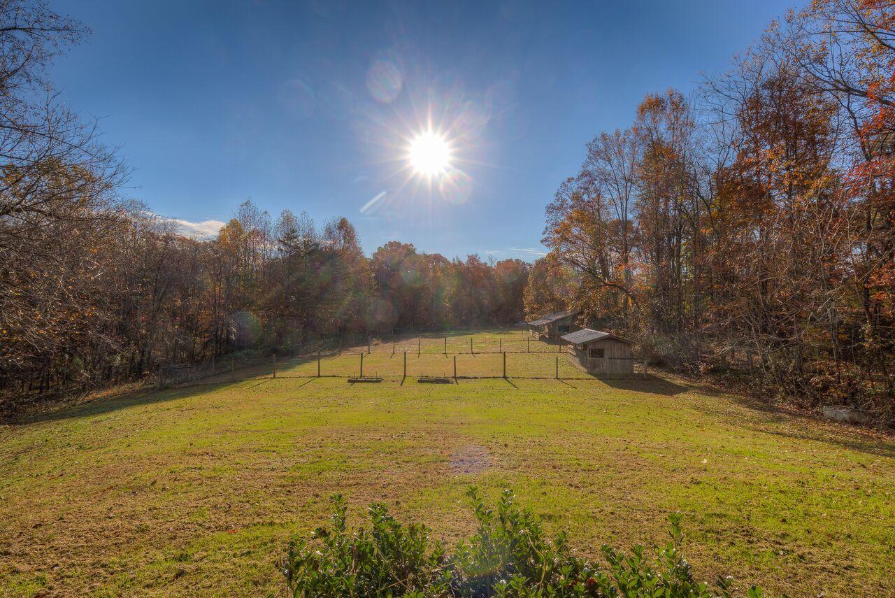 224 Shade Hollow Road Blue Ridge, VA 24064 - Photo 5 of 38 a view of a swimming pool with an outdoor space and seating area