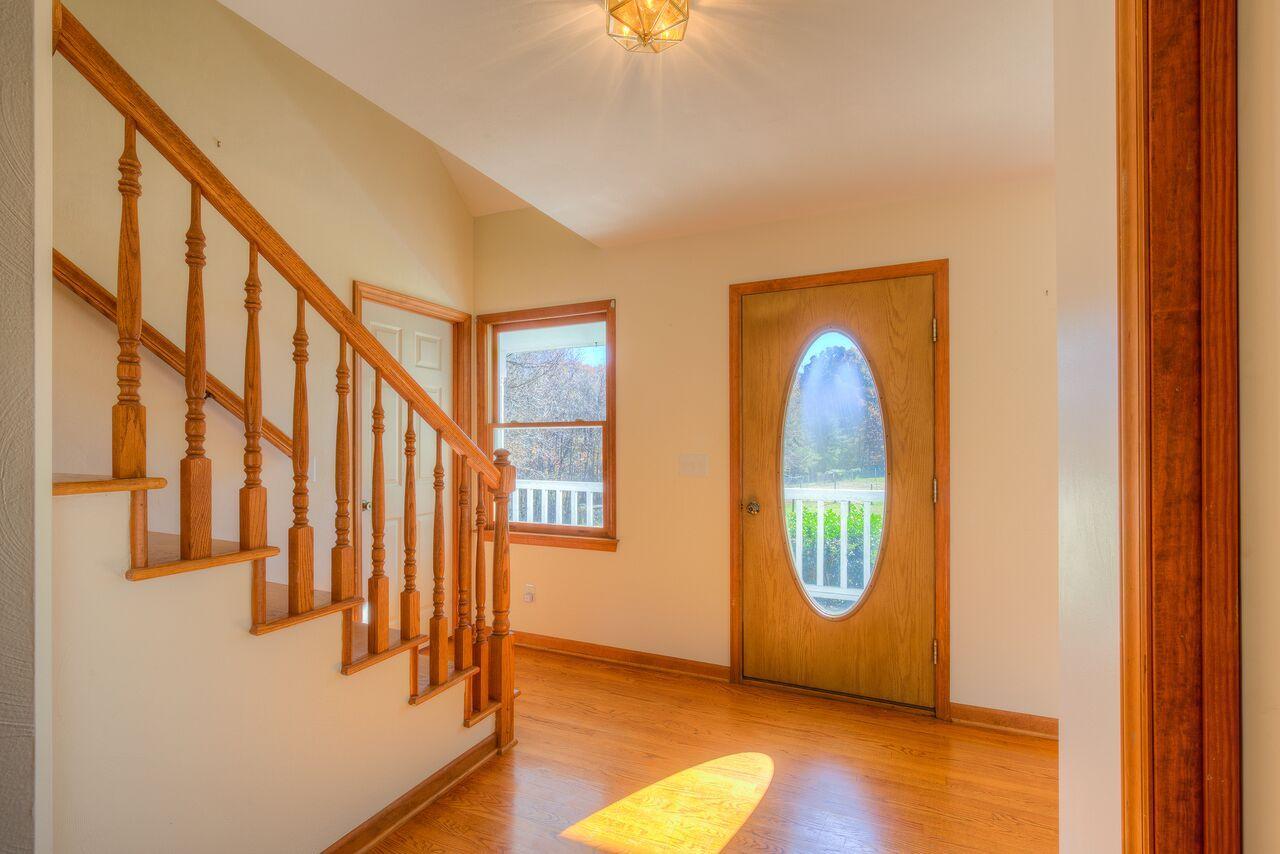 224 Shade Hollow Road Blue Ridge, VA 24064 - Photo 6 of 38 a view of an entryway with wooden floor