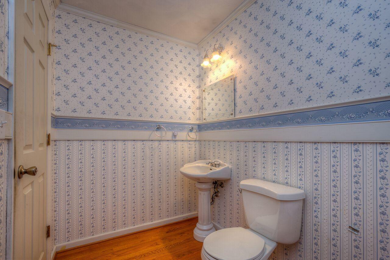 224 Shade Hollow Road Blue Ridge, VA 24064 - Photo 9 of 38 a bathroom with a toilet and a sink