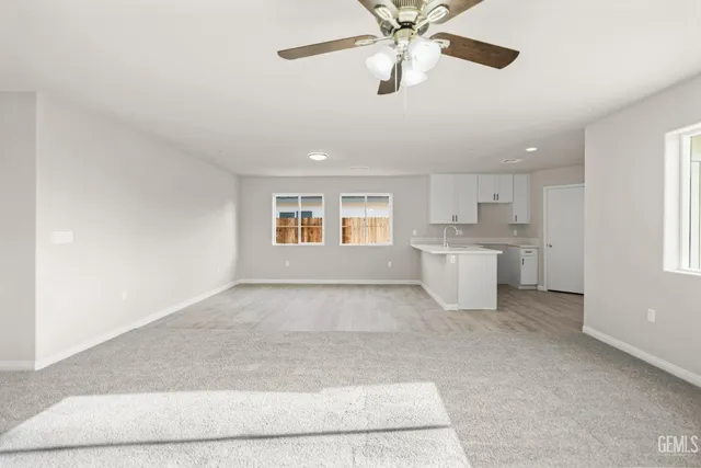 a view of a kitchen with a sink and a window