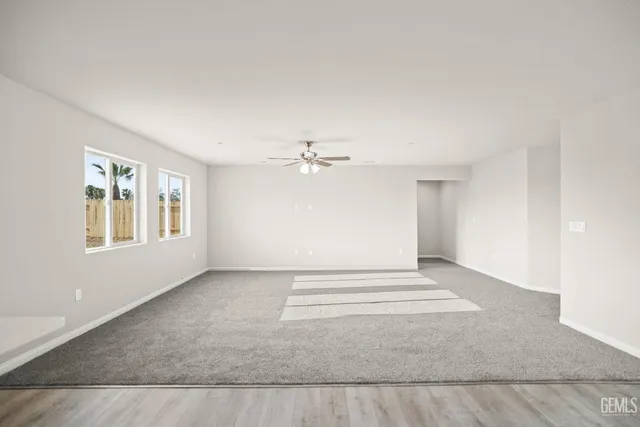 a view of kitchen with white cabinets