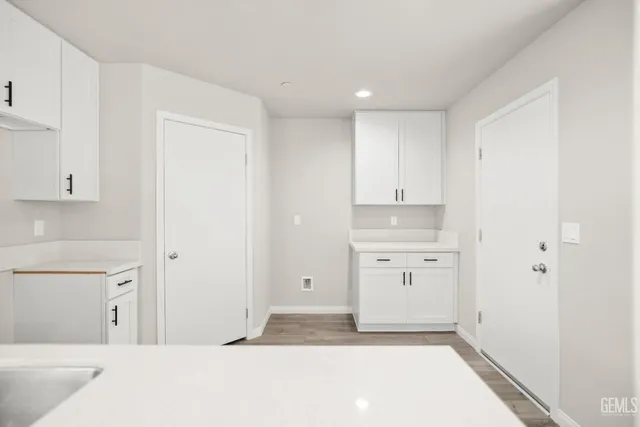 a kitchen with cabinets a sink and dishwasher in it