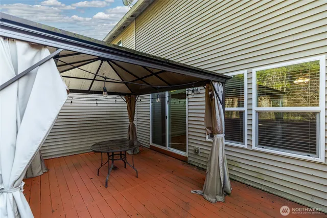 a view of outdoor space with deck and furniture