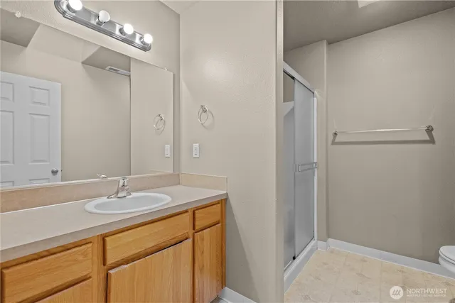 a bathroom with a sink double vanity and a mirror