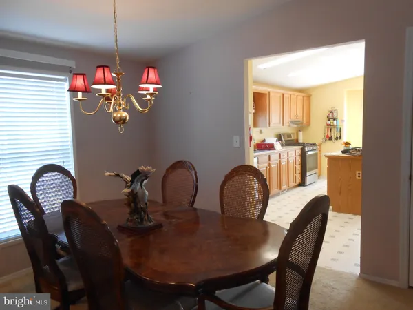 a kitchen with granite countertop a sink cabinets and window