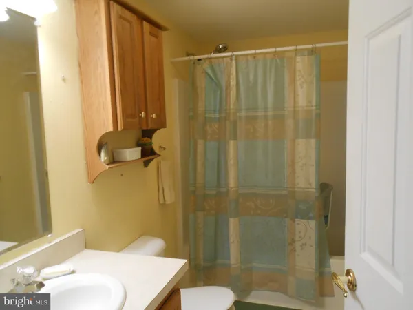 a view of walk in closet with clothes