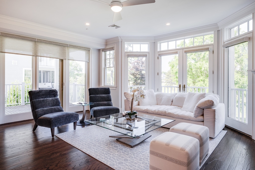 66 Simons Road, Unit C Mashpee, MA 02649 - Photo 12 of 42 a living room with furniture and floor to ceiling windows